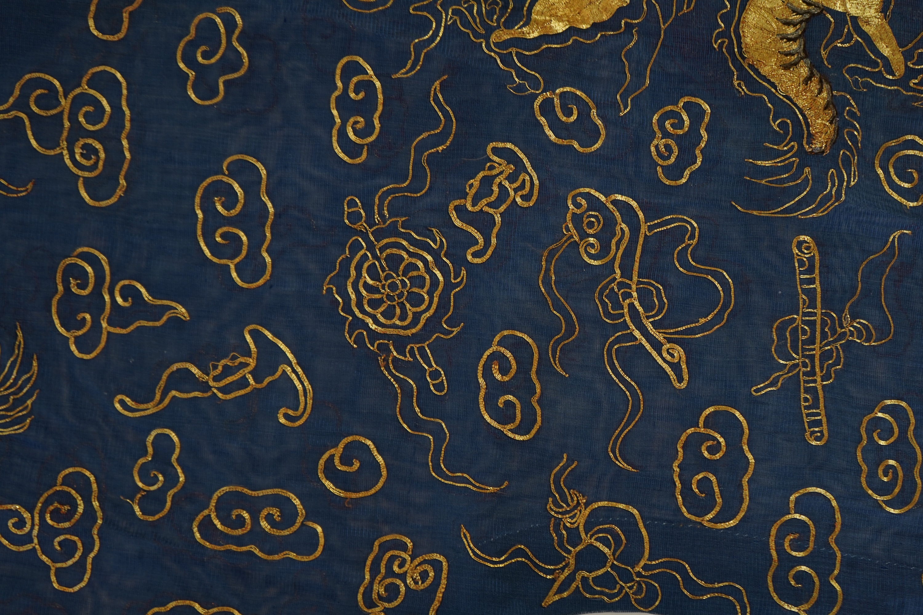 A Chinese gold thread and silk gauze ‘dragon’ summer robe, jifu, early 20th century